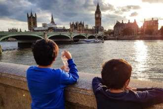 Children looking at Big Ben and the River Thames from the South Bank in London