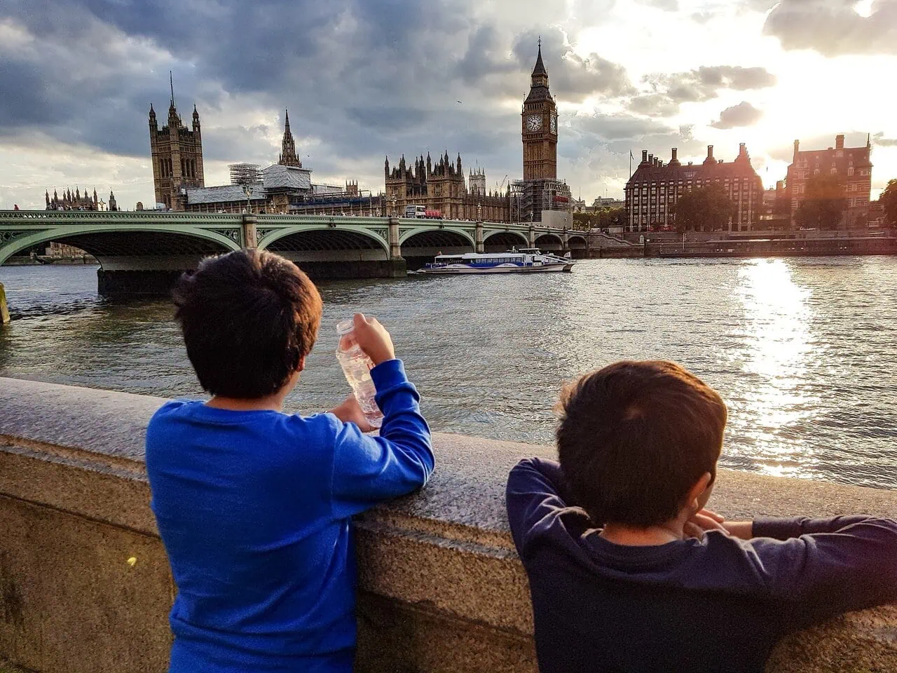 Children looking at Big Ben and the River Thames from the South Bank in London