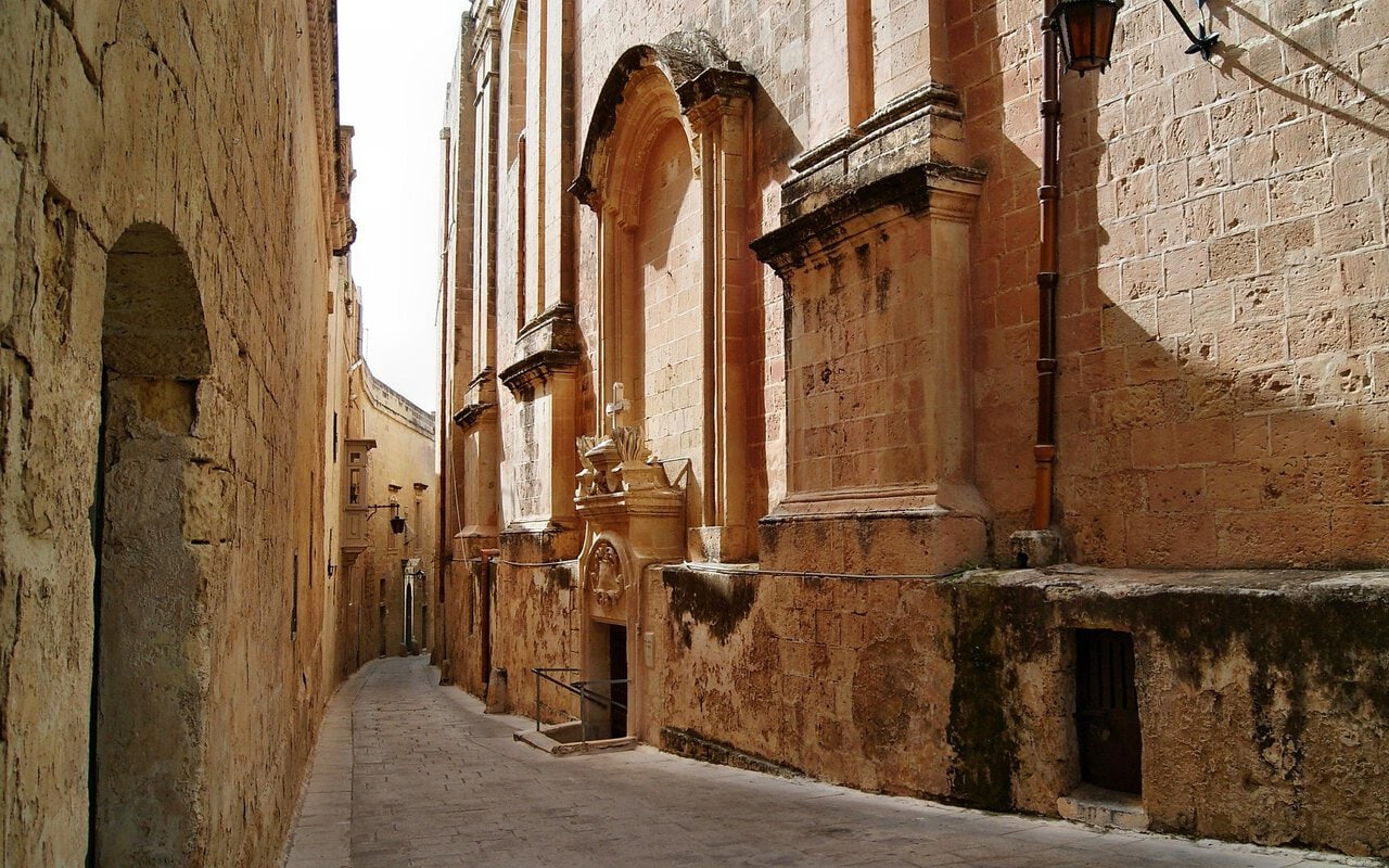 Narrow limestone street in Valletta Malta near St John’s Co-Cathedral
