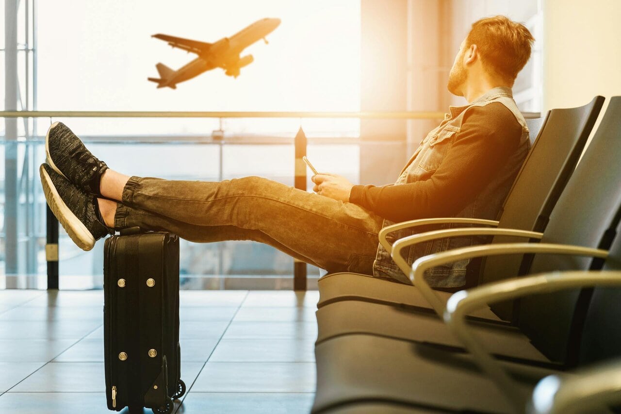 Traveller waiting in airport after missing flight check-in