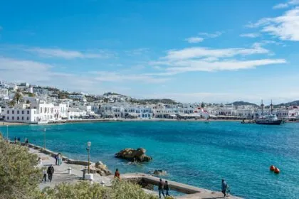 Mykonos Town coastline with white buildings and turquoise sea Greece