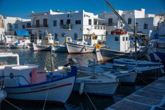 Traditional fishing boats in Paros harbour Cyclades Greece