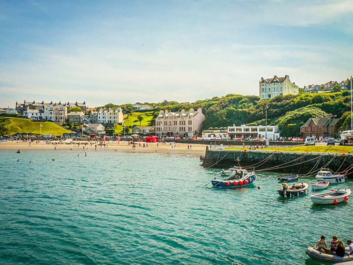 Port Erin beach and harbour on the Isle of Man with boats and seaside village