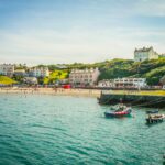 Port Erin beach and harbour on the Isle of Man with boats and seaside village