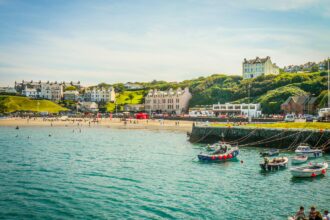 Port Erin beach and harbour on the Isle of Man with boats and seaside village