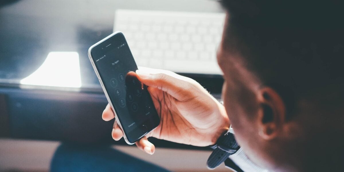 Traveller using smartphone mobile data for eSIM travel connectivity