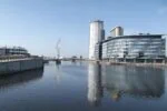 Salford Quays waterfront with MediaCityUK and modern buildings along the Manchester Ship Canal