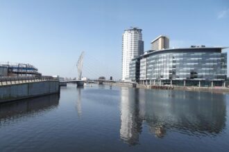 Salford Quays waterfront with MediaCityUK and modern buildings along the Manchester Ship Canal
