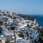 Santorini caldera view with white buildings and blue sea in Oia Greece