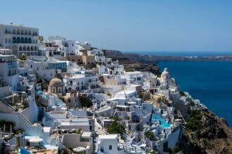 Santorini caldera view with white buildings and blue sea in Oia Greece