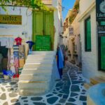 Paros old town street with shops and white buildings Greece