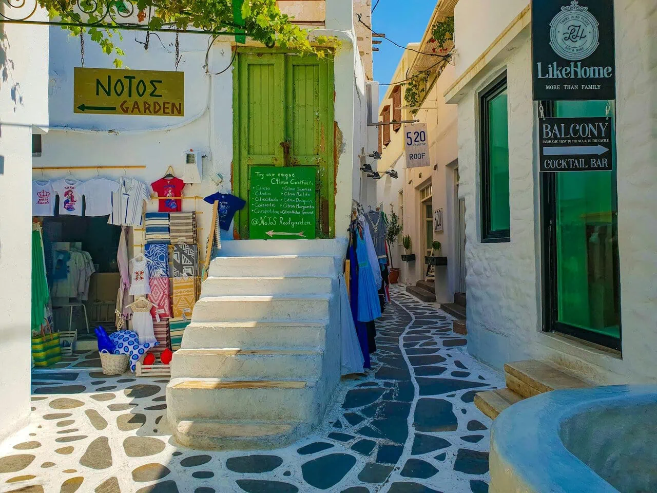 Paros old town street with shops and white buildings Greece