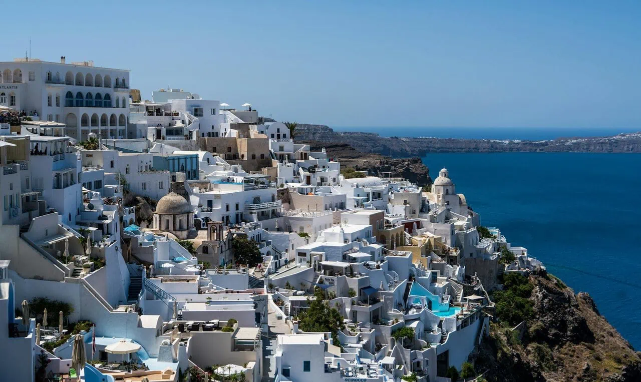 Santorini caldera view with white buildings and blue sea in Oia Greece