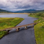 Scenic railway line crossing river in the Scottish Highlands ScotRail route