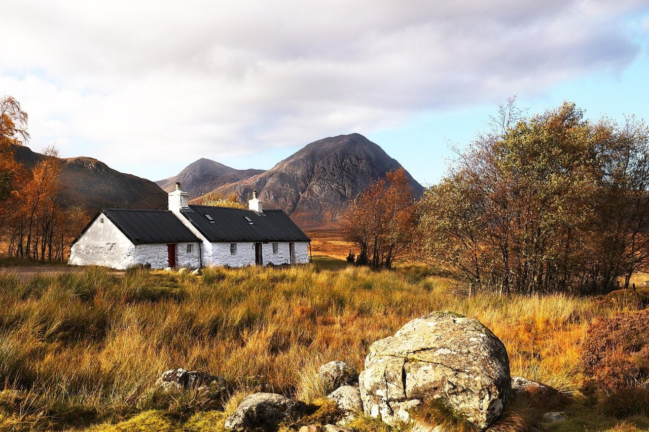 Scottish Highlands cottage and mountains on the North Coast 500 route