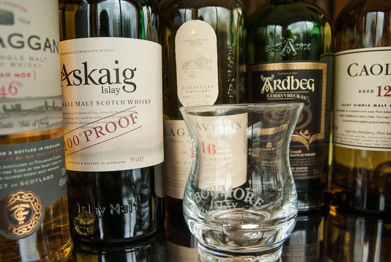 Scottish whisky bottles and tasting glass from Islay distilleries