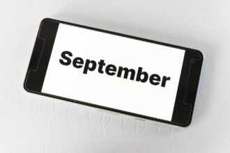 Best places to visit in September shown on smartphone screen