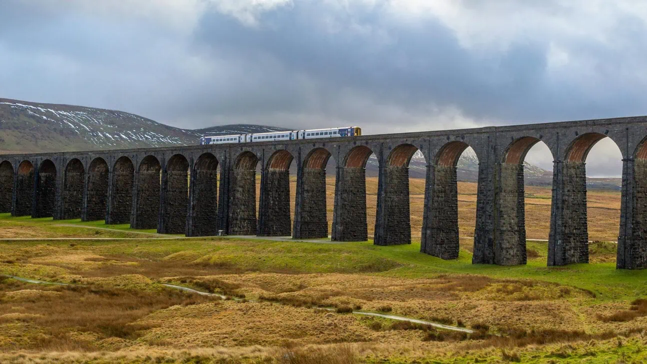 Settle to Carlisle railway train crossing Ribblehead Viaduct Yorkshire Dales