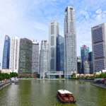 Singapore River cruise boat with city skyline