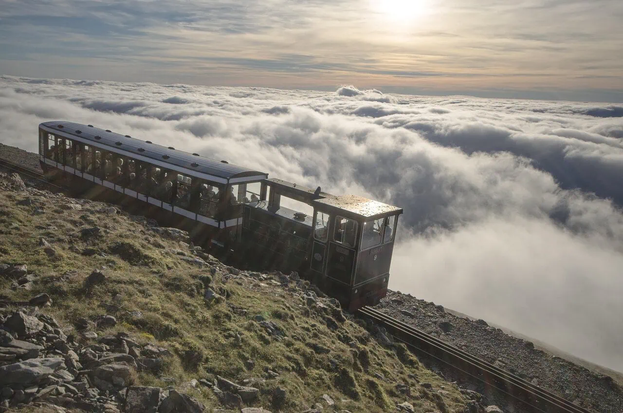 Snowdon Mountain Railway train above clouds on Mount Snowdon in Wales