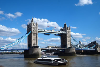 Tower Bridge London with Thames River cruise boat on the River Thames