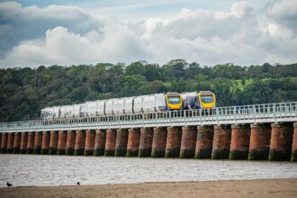 Train crossing Barmouth Bridge on Cambrian Coast Line in Wales