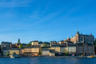 Waterfront skyline of Stockholm viewed across the Baltic waterfront under a clear blue Scandinavian sky