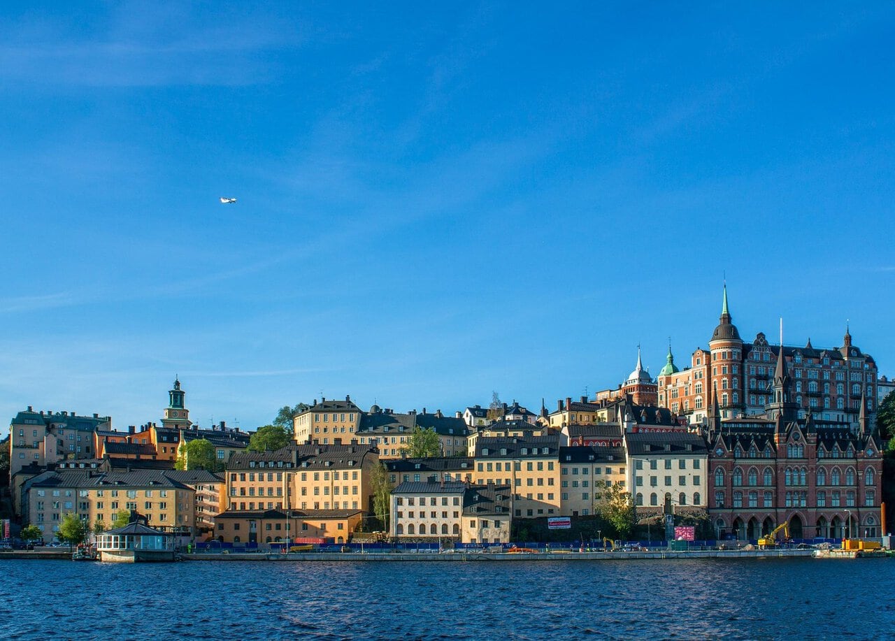 Waterfront skyline of Stockholm viewed across the Baltic waterfront under a clear blue Scandinavian sky