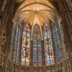 Colourful stained glass windows inside a historic church in Carcassonne, southern France.