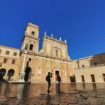 Historic cathedral square in Brindisi in Southern Italy under a clear blue sky