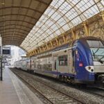 SNCF regional train inside a large French railway station used for journeys covered by the Carte Avantage rail discount card.