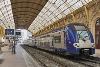 SNCF regional train inside a large French railway station used for journeys covered by the Carte Avantage rail discount card.
