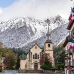 Chamonix town centre with church and Mont Blanc mountains in the background after transfer from Geneva Airport