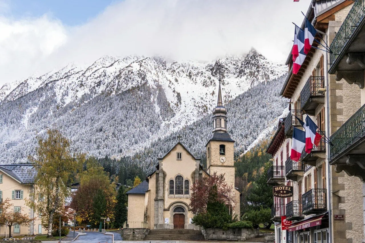 Chamonix town centre with church and Mont Blanc mountains in the background after transfer from Geneva Airport