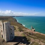 Historic Cornish tin mining ruins and engine house overlooking the Atlantic coast in Cornwall’s UNESCO mining landscape.