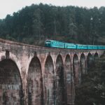 Blue train crossing the Nine Arch Bridge near Ella Sri Lanka