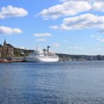 Cruise ship sailing through Oslofjord beside Oslo waterfron