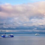 Passenger ferries crossing the Baltic Sea near Tallinn under dramatic skies