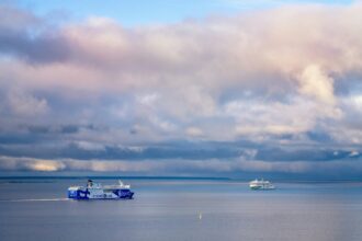 Passenger ferries crossing the Baltic Sea near Tallinn under dramatic skies