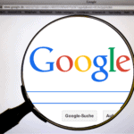 Magnifying glass over Google search page representing Google Flights extreme day trip planning and flight search tools