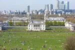View across Greenwich Park towards the Queen’s House and Canary Wharf skyline in London