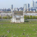 View across Greenwich Park towards the Queen’s House and Canary Wharf skyline in London