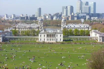 View across Greenwich Park towards the Queen’s House and Canary Wharf skyline in London