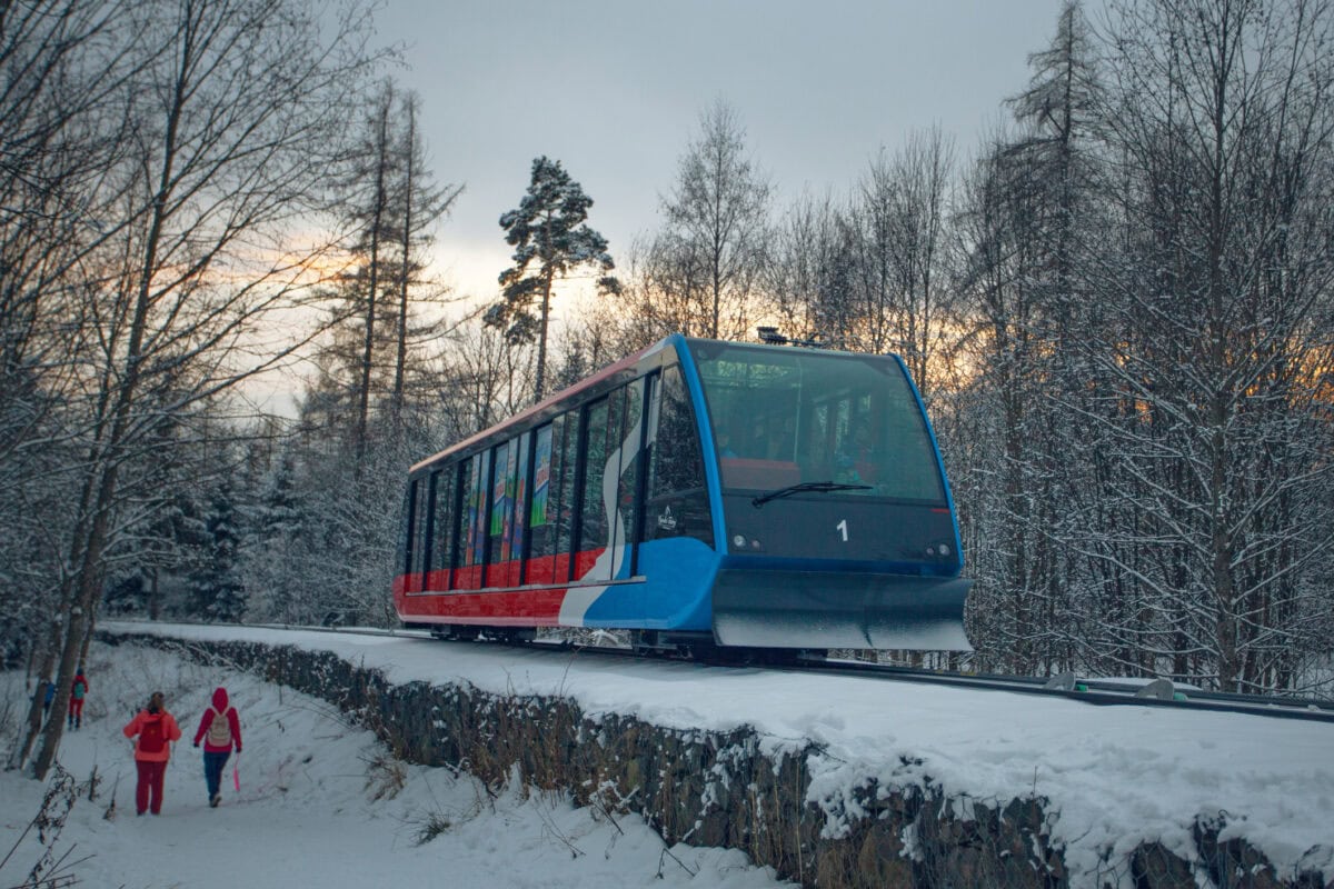 Hrebienok funicular railway travelling through snowy forests in the High Tatras during winter