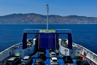 Cars onboard the Villa San Giovanni to Messina ferry crossing the Strait of Messina between mainland Italy and Sicily