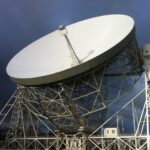 The giant Lovell Telescope at Jodrell Bank Observatory in Cheshire beneath dramatic dark skies