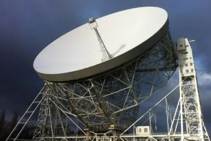 The giant Lovell Telescope at Jodrell Bank Observatory in Cheshire beneath dramatic dark skies