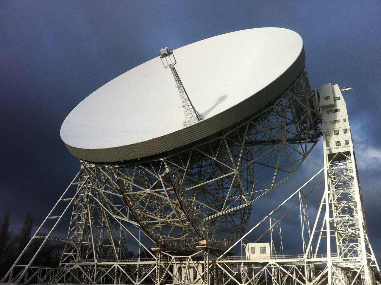 The giant Lovell Telescope at Jodrell Bank Observatory in Cheshire beneath dramatic dark skies