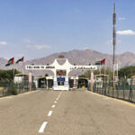 Jordan border crossing near Aqaba with Welcome to Jordan gateway and desert mountains