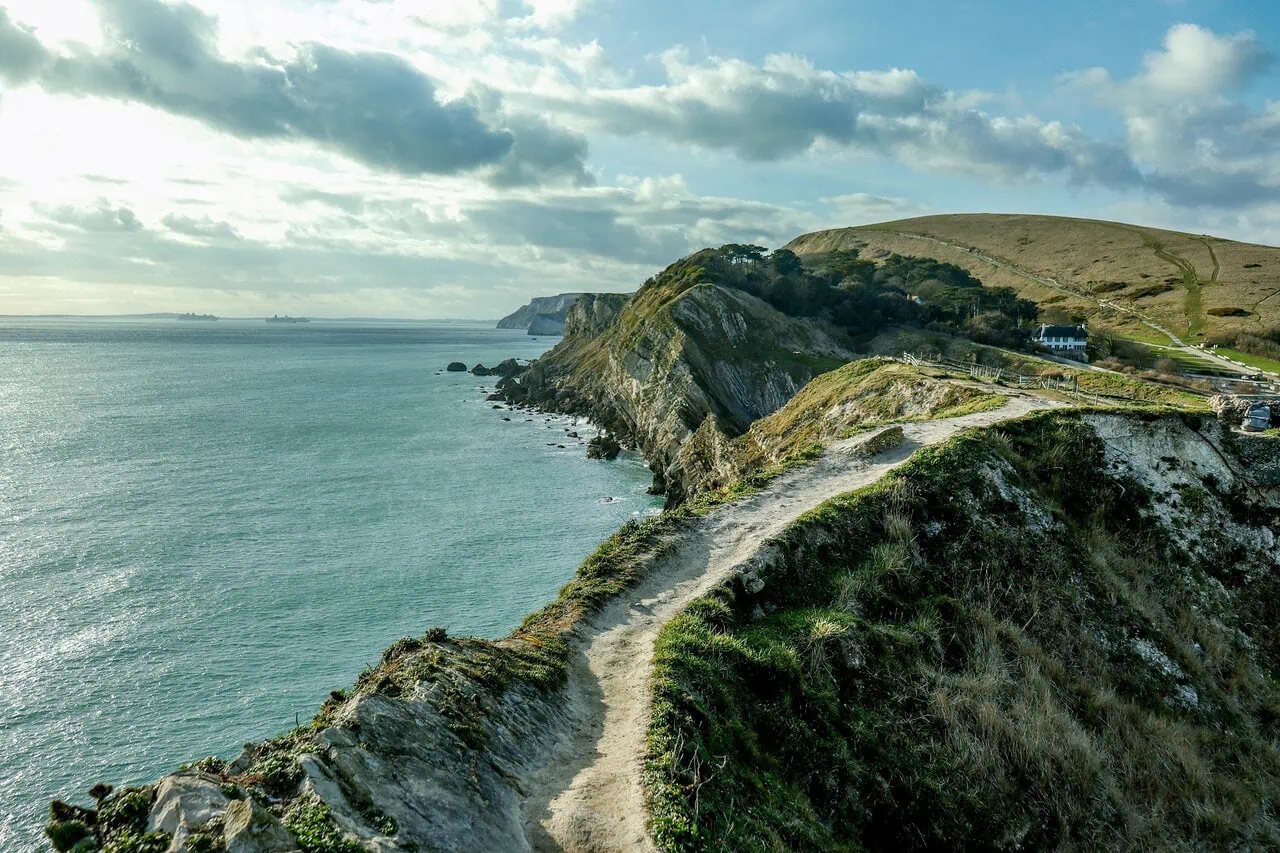 Clifftop walking path overlooking the Jurassic Coast in Dorset with dramatic coastal scenery and sea views